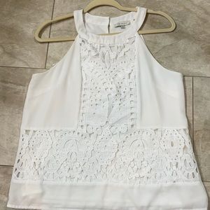 White blouse , brand skies are blue ,